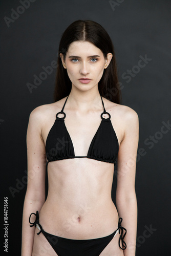 Young beautiful fashion model woman posing in studio, natural beauty, clean skin, professional modeling portfolio, elegant female portrait, modern style, confident look, people concept photography