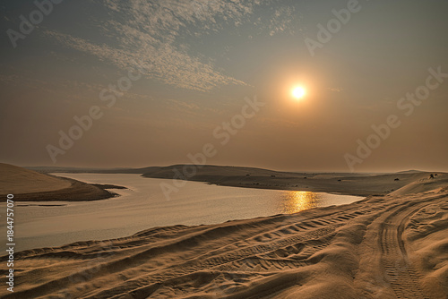 Fototapeta Naklejka Na Ścianę i Meble -  The Mesaieed Desert meets the sea in Doha, Qatar.