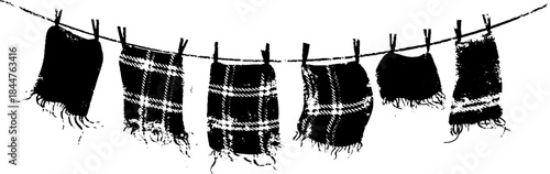 Black and white stencil illustration of shredded tartan fabric on clothesline for urban art