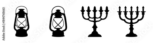 Silhouettes of vintage oil lanterns and traditional menorah candelabras