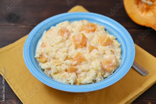 a bowl of pumpkin porridge, homemade food on the table closeup