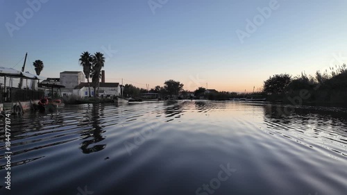 Albufera lake house reflection in valencia at moonrise