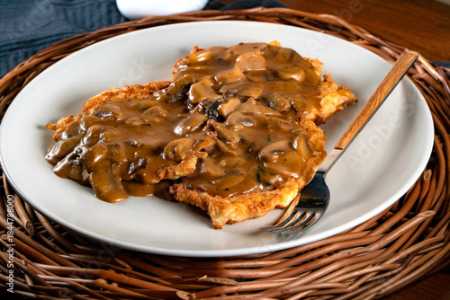 Fototapeta Naklejka Na Ścianę i Meble -  Sauerkraut pancakes /fuczka/ with mushroom sauce .