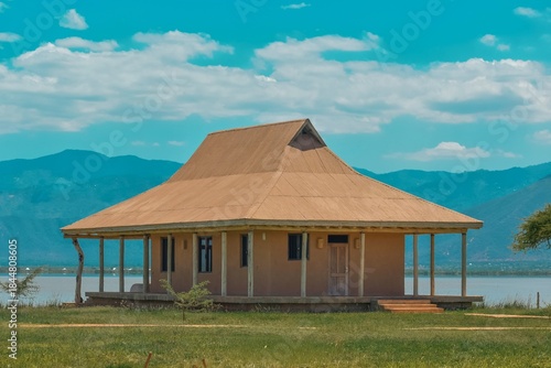 A lakeside cabin against a Mountain background at Lake Jipe in Tsavo West National Park in Kenya 
