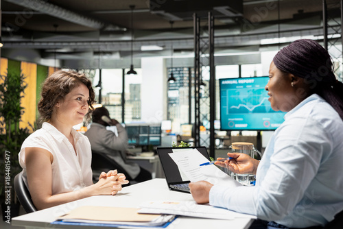 Obraz na plátne Businesswoman from human resources explains contract deal benefits to a candidate, including salary details, annual wellness programs and rights related to employment and schedule flexibility
