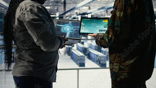 Fotografie Close up of army general and coworker in data center integrating AI into radar systems for missile tracking