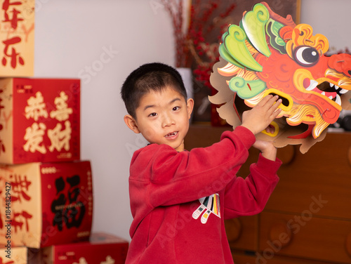 Chinese children perform dragon dance for Chinese New Year.
