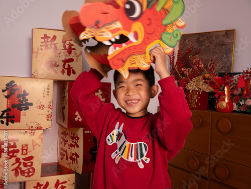 Chinese children perform dragon dance for Chinese New Year.
