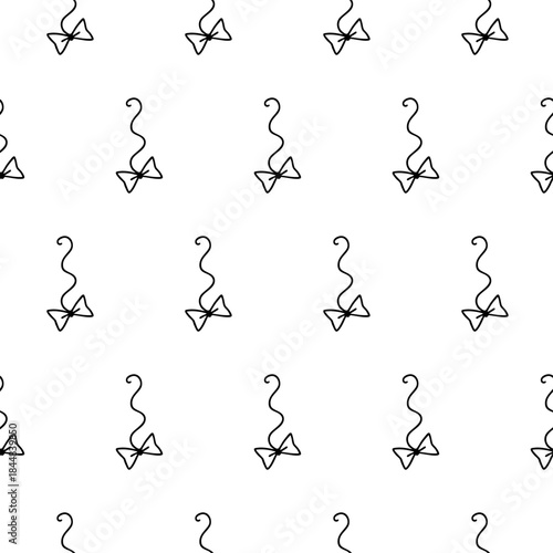 Hand drawn seamless pattern with bow on string cat toy. Vector pet toy background.