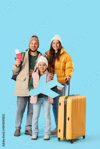 Family of travelers with su...