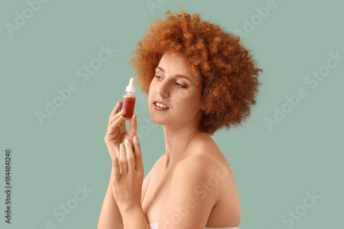 Young redhead woman with na...