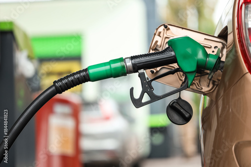 Refueling nozzle in car's f...
