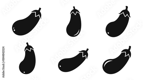 A collection of dark eggplant shapes in various orientations silhouette