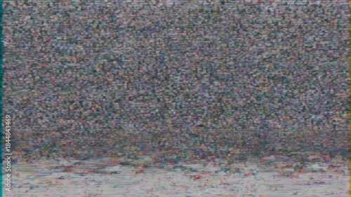 Abstract static noise and color bars on old television screen.