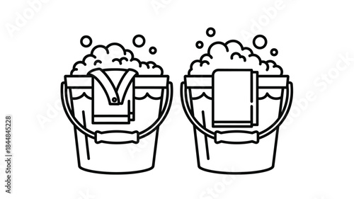 Two buckets filled with soapy water and cleaning supplies silhouette