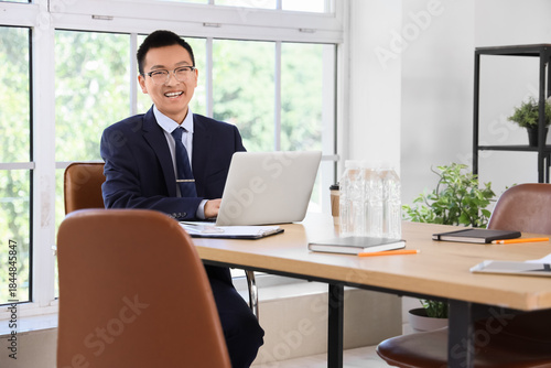 Chinese businessman working...