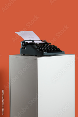 Vintage typewriter on pedes...