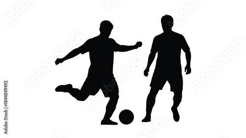 Two male figures playing soccer with a ball a dramatic silhouette