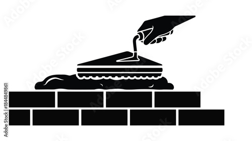 Hand pouring liquid onto a tiered dessert a clean black silhouette