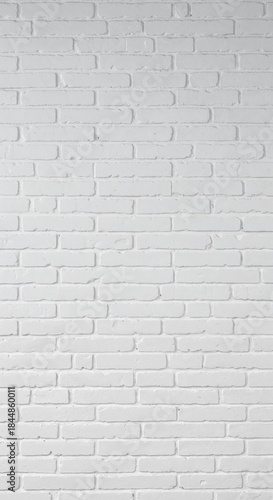 A full frame of a clean white painted brick wall background, highlighting the uniform texture of individual bricks and mortar joints with subtle light and shadow.