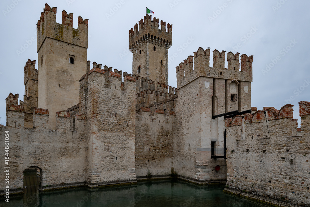 Obraz premium Castello Scaligero di Sirmione moat and towers - Sirmione, Italy