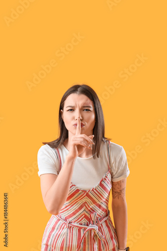 Young gossip woman showing ...