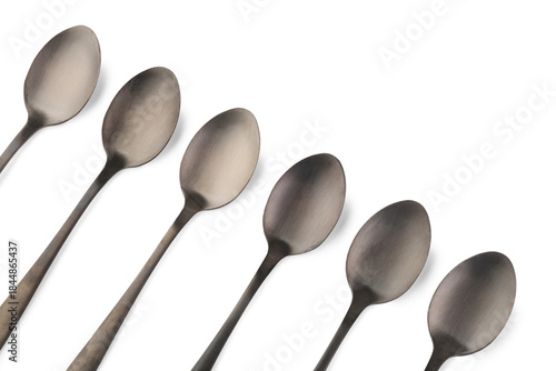 Stainless steel spoons on w...