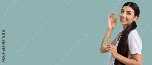 Young woman with vitamin E ...