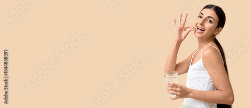 Young woman with glass of w...