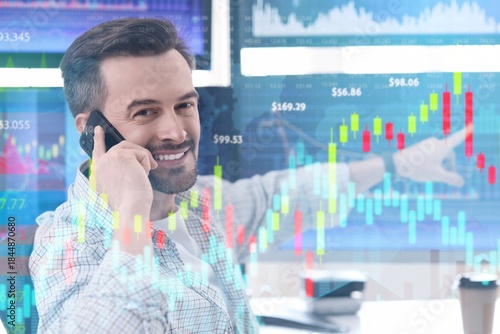 Male trader talking by mobi...