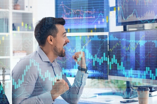 Happy male trader working a...
