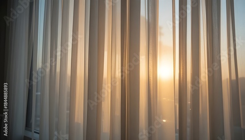 Sheer curtains glowing softly with early morning light