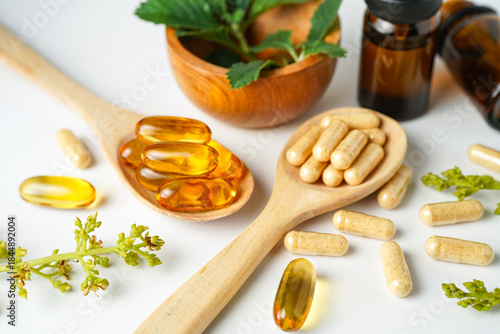 Alternative medicine herbal organic capsule vitamin E omega 3 fish oil drug herbs leaf natural