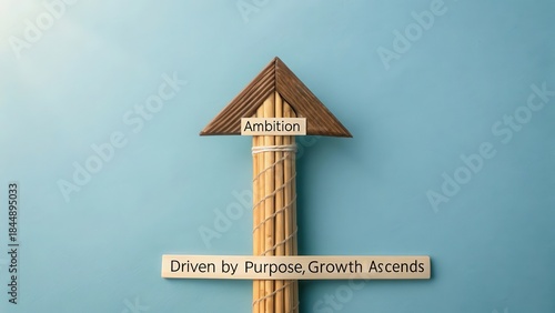 Stylized Wooden Arrow Pointing Upward With 'Ambition' and 'Driven by Purpose, Growth Ascends' Signposts Against Blue Background