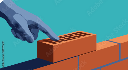 A gloved hand carefully places a single orange brick onto a growing wall, symbolizing construction, strategic development, and the foundational steps of a new project.