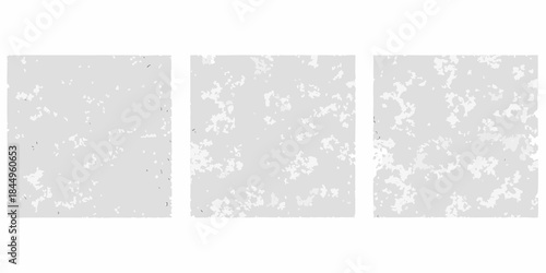 Three gray panels with a speckled textured and slightly mottled surface