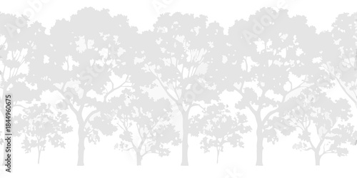 A grayscale silhouette of a dense forest with many trees