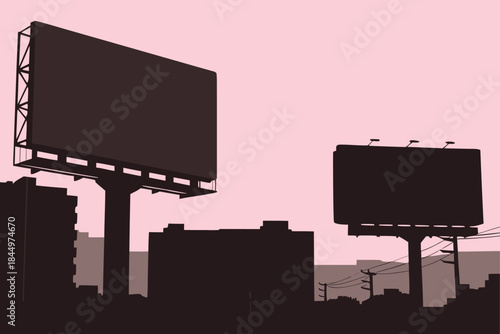 Dynamic cityscape silhouette with prominent billboards under a soft pink sky offering powerful advertising possibilities for brands seeking urban visibility