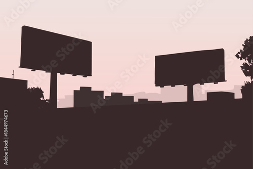 Dramatic cityscape silhouette at dusk with prominent billboards, perfect for urban development or advertising campaigns looking for a powerful, modern edge