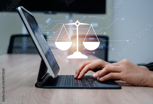 Concept of AI regulations and digital law with virtual scale of justice icon and circuit appear while hands work with tablet. Ethical AI, legal compliance and technology governance in the digital age.