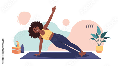 Smiling African American woman with curly hair practicing a side plank yoga pose on a mat at home for a healthy lifestyle.