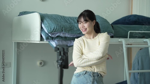 Asian girl record video dancing up load to social media