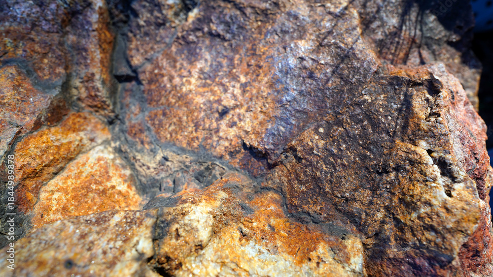 Obraz premium Weathered Iron Ore Texture Showing Rust and Natural Oxidation