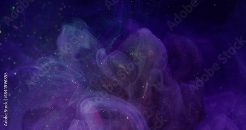 Glitter splash. Acrylic ink liquid. Blur pink blue neon color swirling fog cracked light bulb on abstract creative bokeh background.