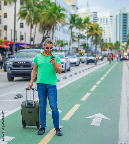 Photography Mature man traveler with phone outdoor
