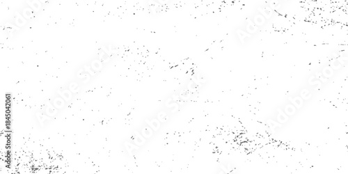 Abstract black and white grunge texture of an aged, rough stone wall surface with a vintage, dirty paper pattern