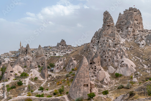 Panorama of Uçhisar, an ancient village nestled at the base of a huge rock cone, Cappadocia, Türkiye