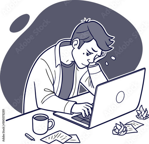 Exhausted man at desk illustrating the concept of workplace burnout