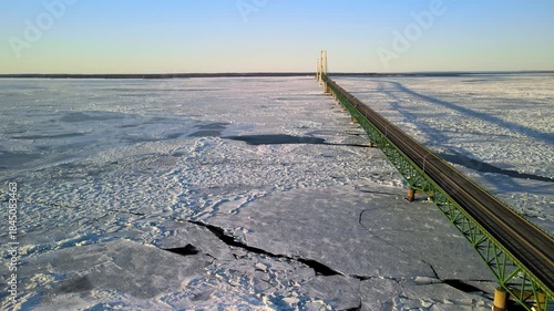 Scenic view of frozen lake Michigan in winter time at Mackinac bridge crossing in Michigan