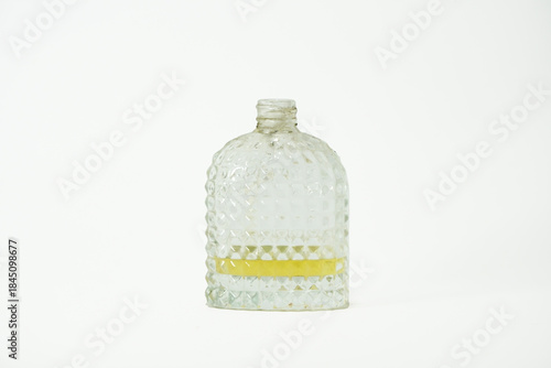 Vintage Glass Bottle perfume bottle Clear vintage glass bottle isolated on white background, decorative container for home decor or packaging concept.